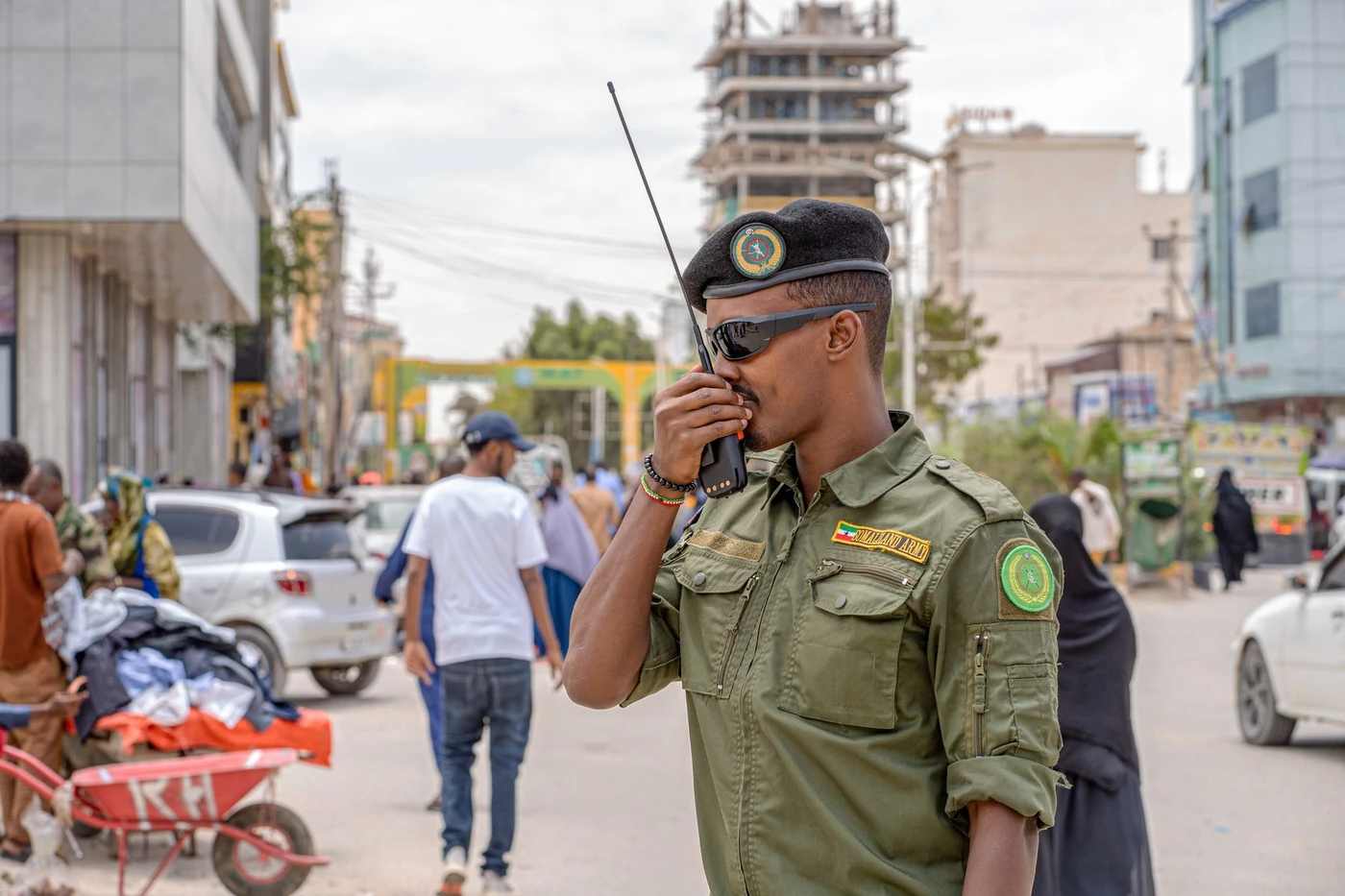 Security officer communicating by handheld radio